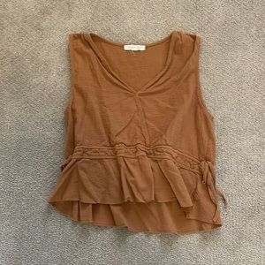 Beige tank top that flares at the bottom